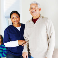 smiling caregiver and senior man