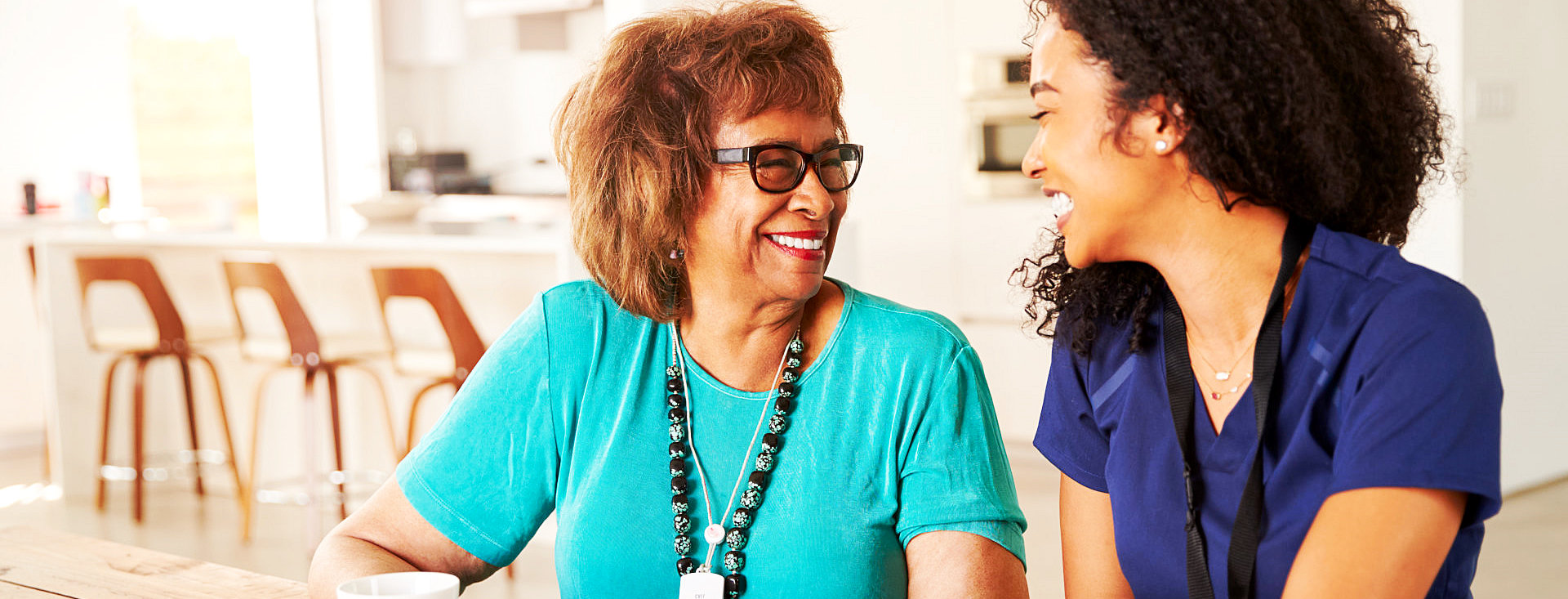 happy caregiver and senior woman