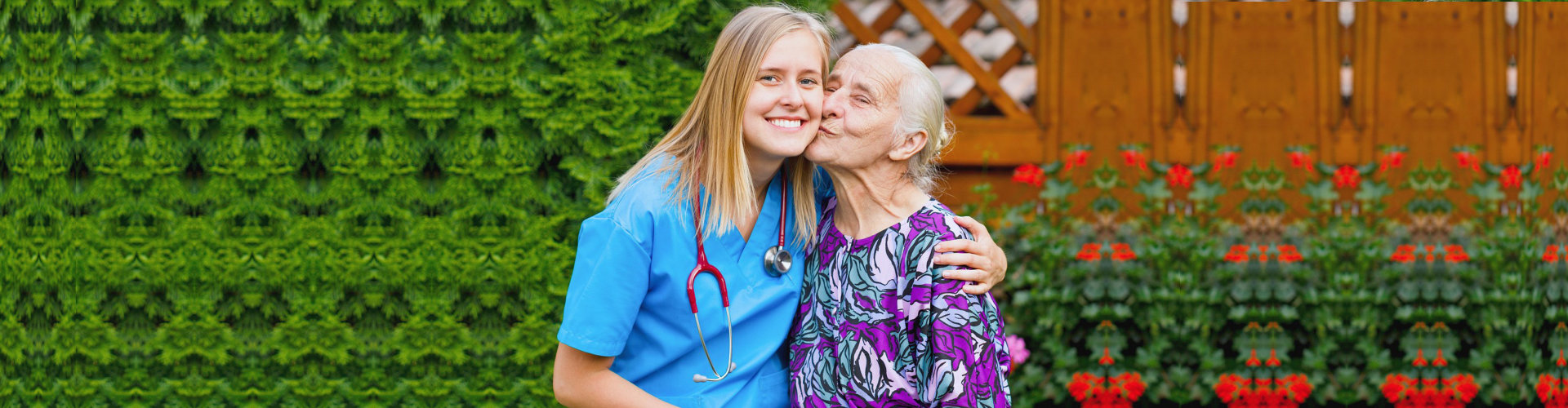 senior woman kissing female nurse's cheek